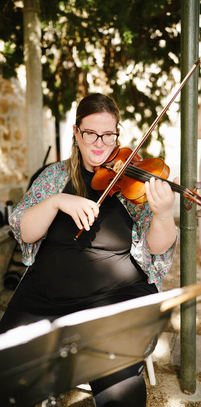 Violinist plays wedding music in Franciscan monastery on Hvar island